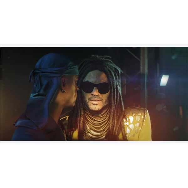 Two characters in a tense conversation, one with dreadlocks and sunglasses, in a dark setting.