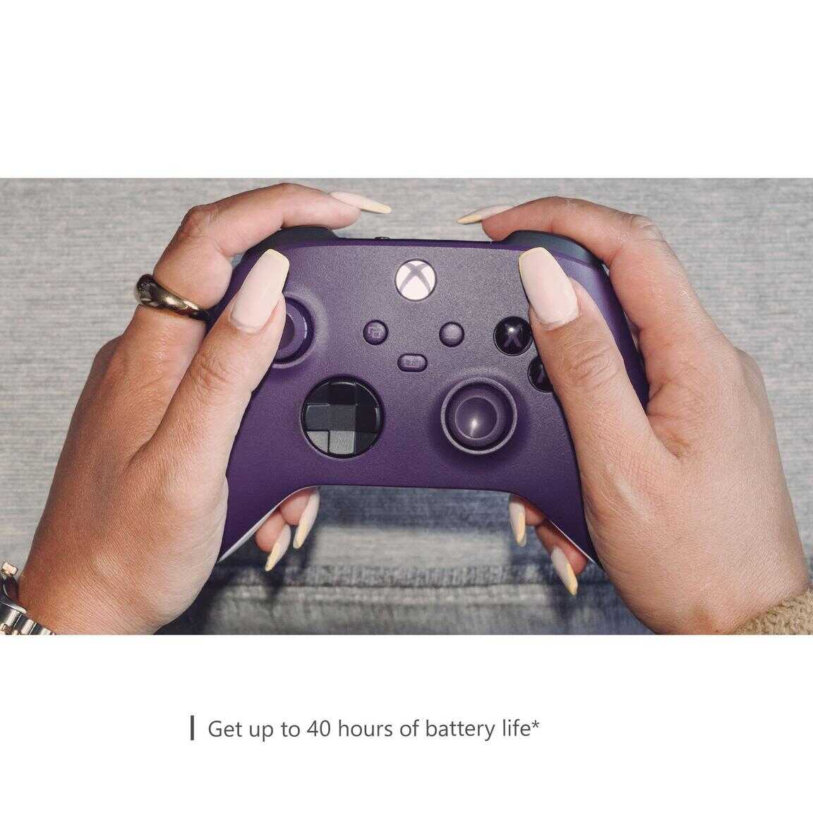 Close-up of a person holding an Astral Purple Xbox Series X wireless controller.