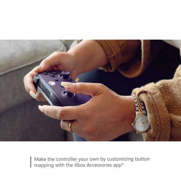 Person holding Xbox Series X wireless controller in Astral Purple color.