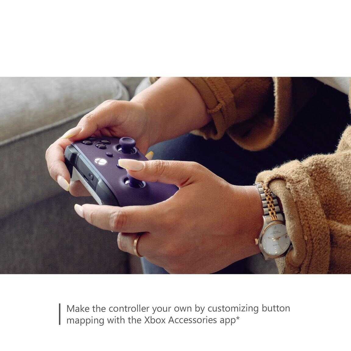 Person holding Xbox Series X wireless controller in Astral Purple color.