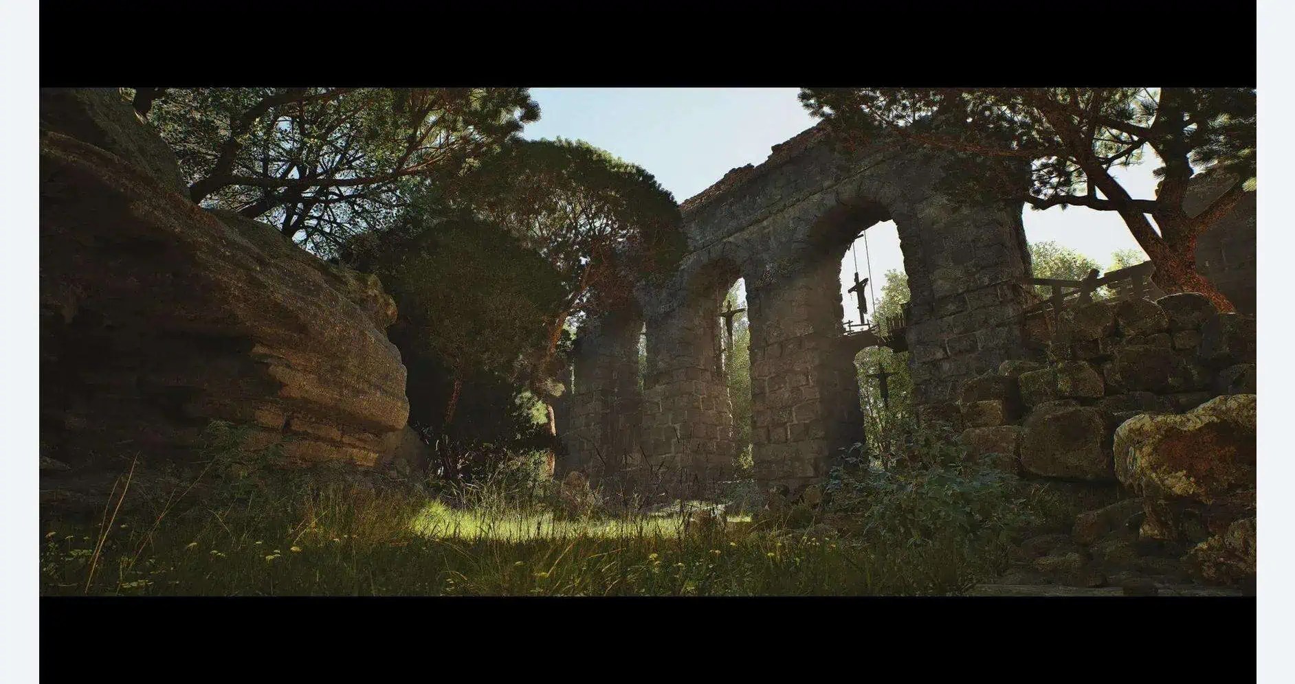 Historic Roman aqueduct ruins in a lush, green landscape.