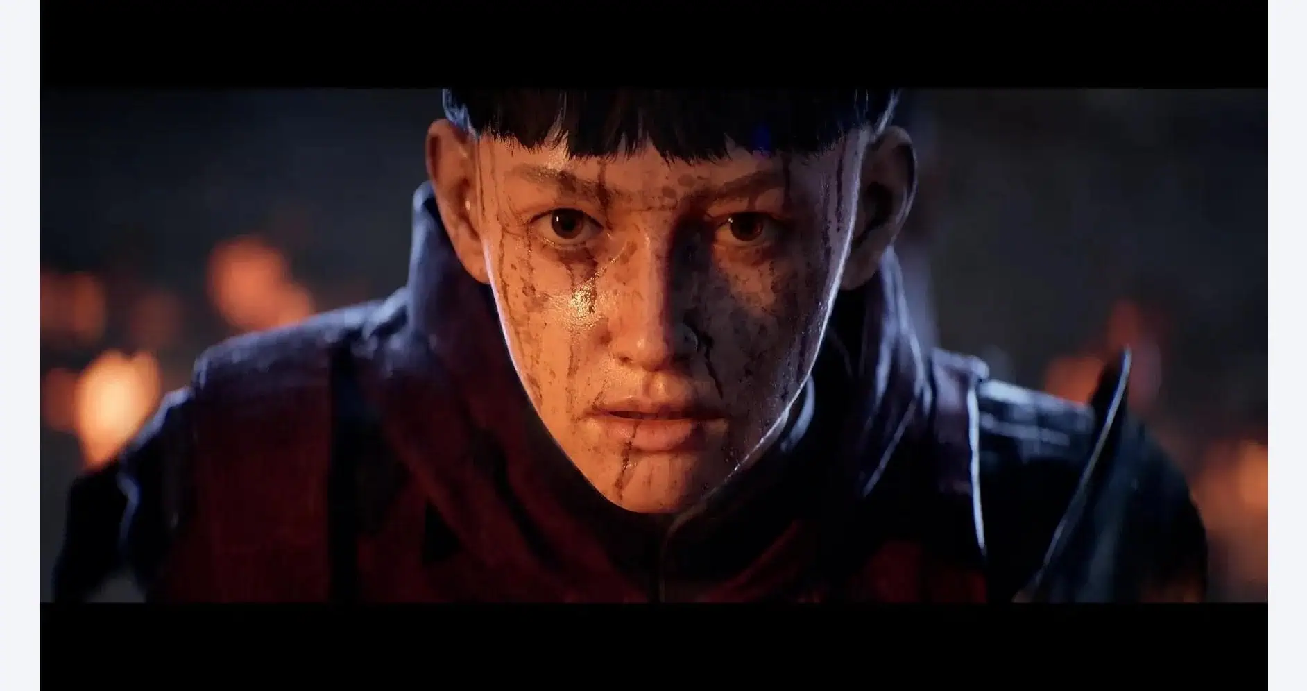 Intense scene from Ex Voto showing a young boy with dirt-covered face.