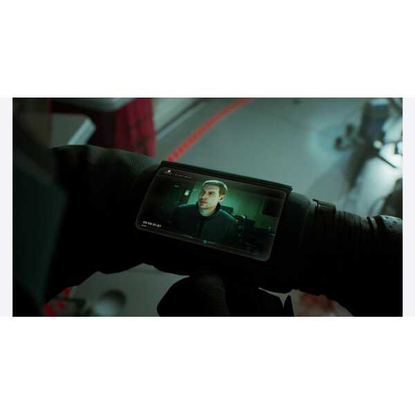Close-up of a professional video camera capturing a scene with a man on a monitor.
