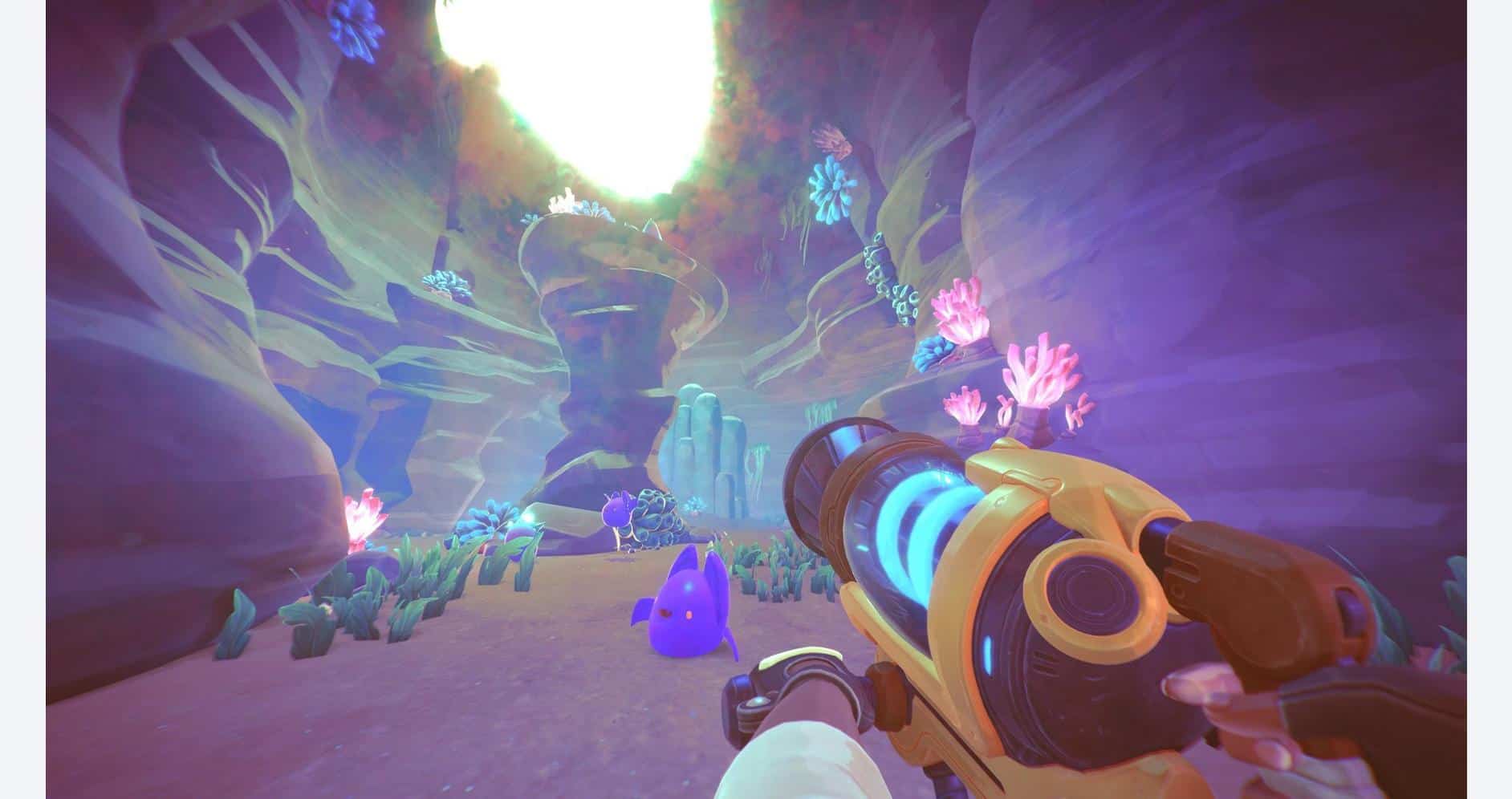 Gameplay scene from Slime Rancher 2 showing colorful slimes and vibrant environment.