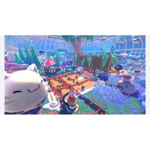 Bright and colorful Slime Rancher 2 gameplay environment with slimes and lush plants.