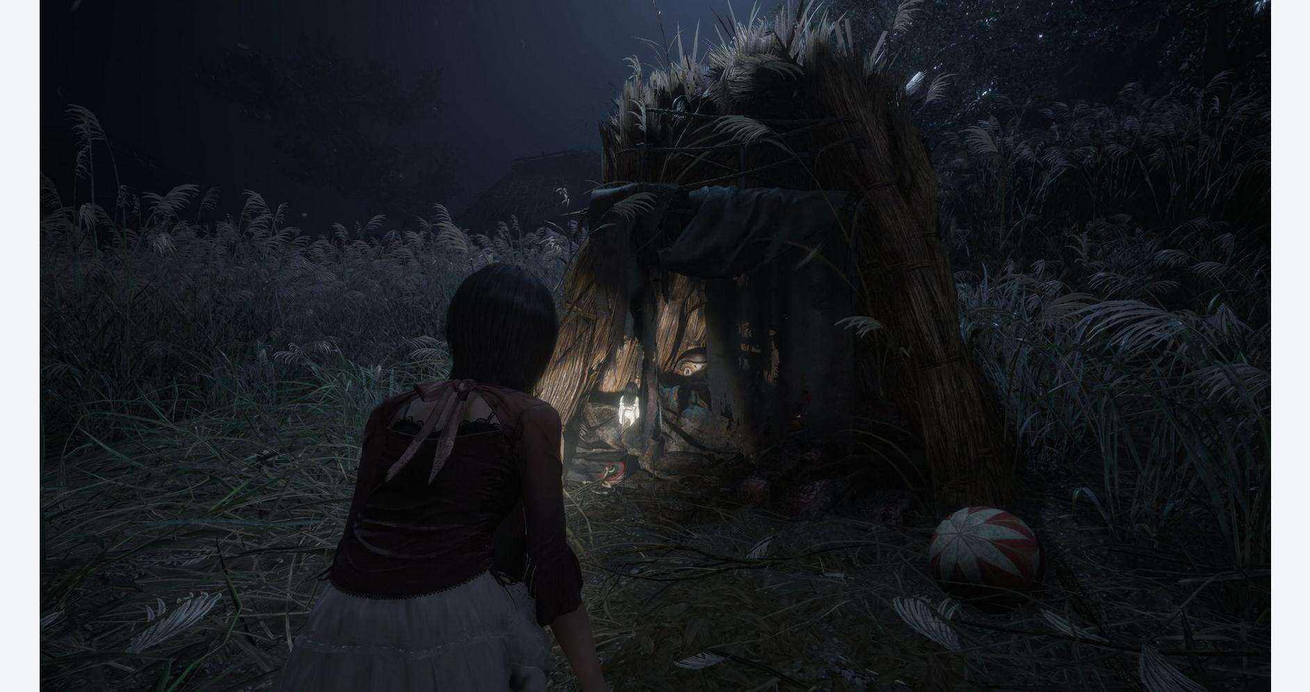 Eerie scene from FATAL FRAME II remake with girl facing a ghostly figure in a dark forest.