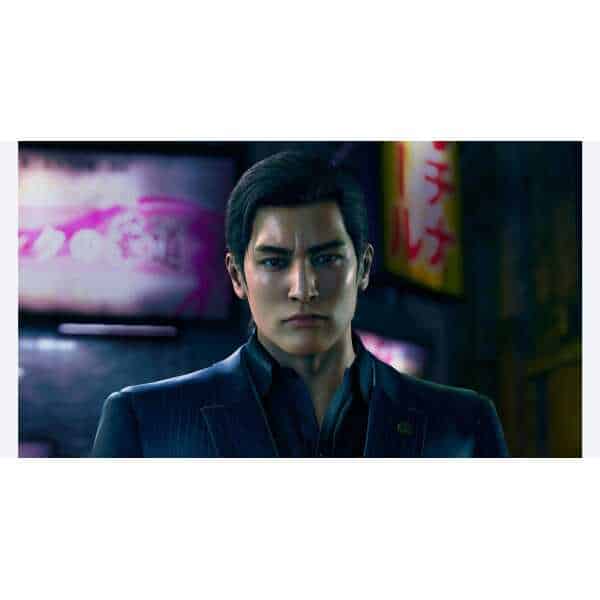 Close-up of a serious male character from Yakuza Kiwami 3 in a dark urban setting.