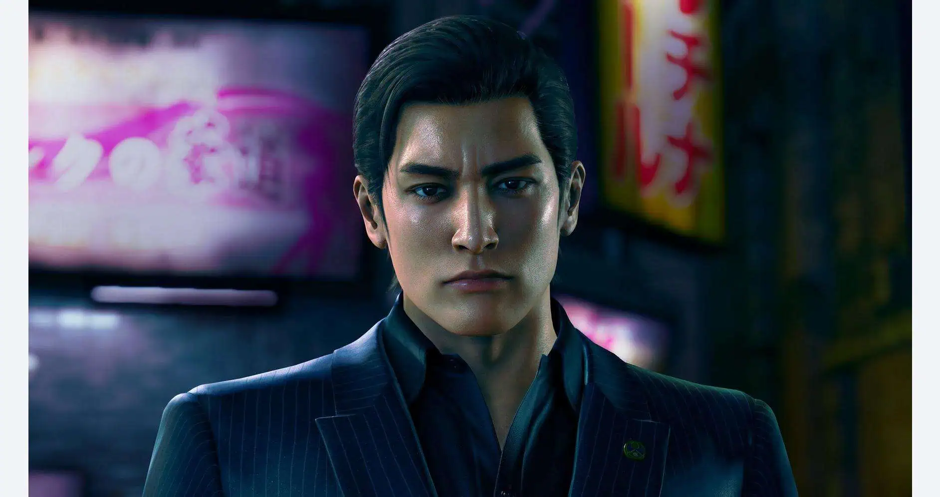 Close-up of a serious male character from Yakuza Kiwami 3 in a dark urban setting.