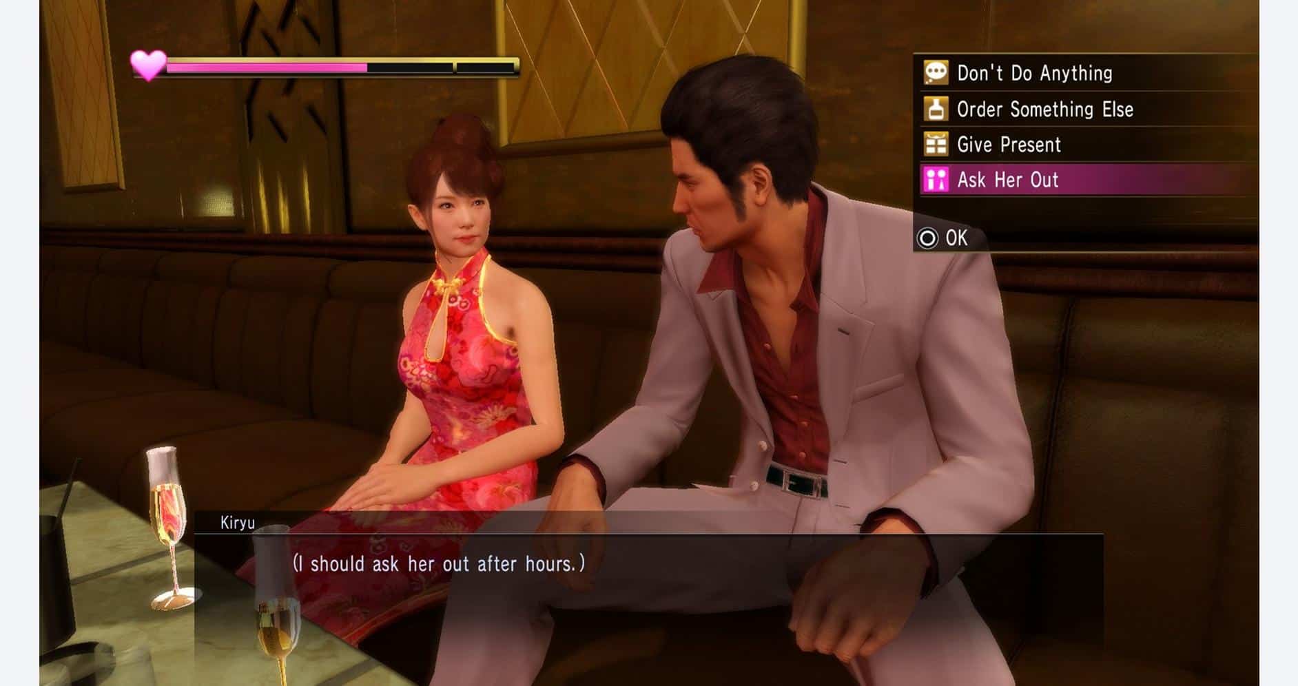 Scene from Yakuza Kiwami 1 showing Kiryu and a female character in a restaurant.