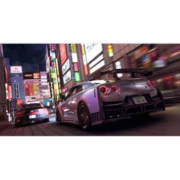 Racing cars from Forza Horizon 6 speeding through vibrant Tokyo city streets at night.