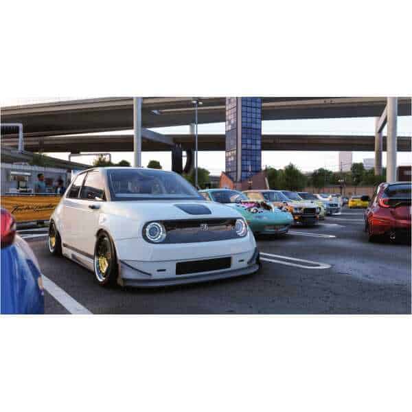 Car parked at a racing event in Forza Horizon 6, showcasing customized vehicles and vibrant atmosphe.
