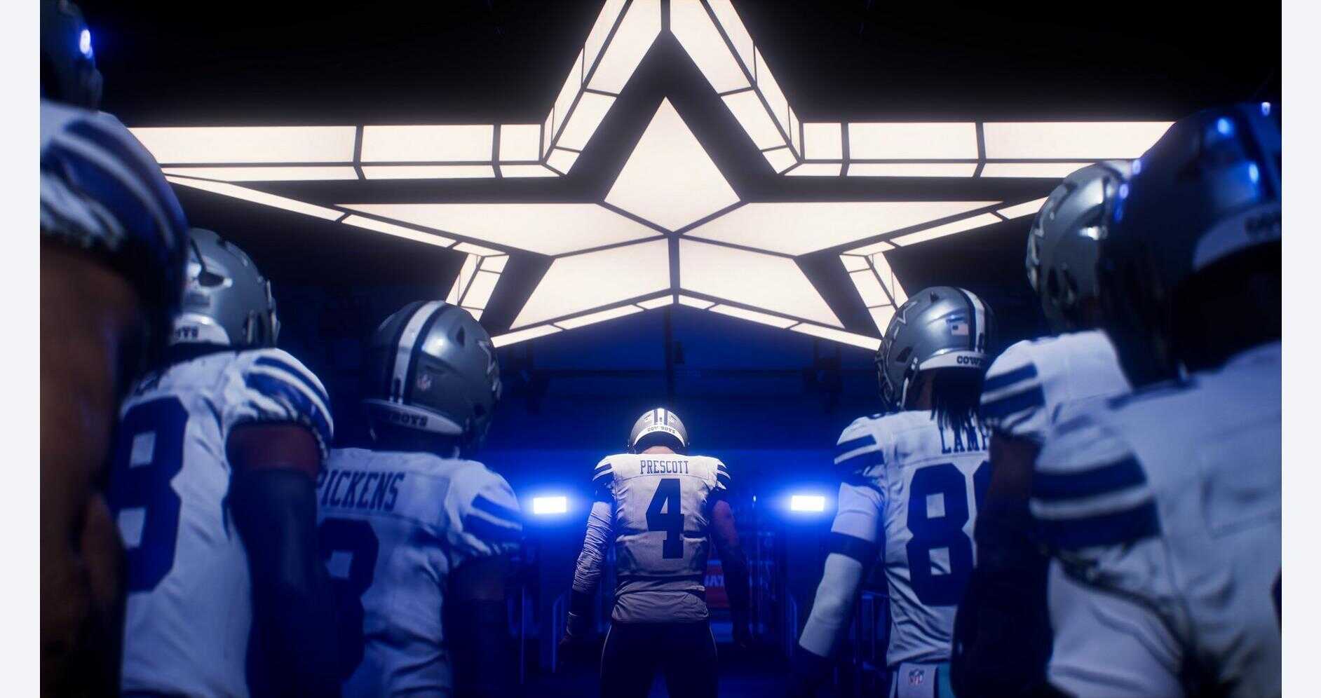 Football players entering the field through a star-shaped tunnel.