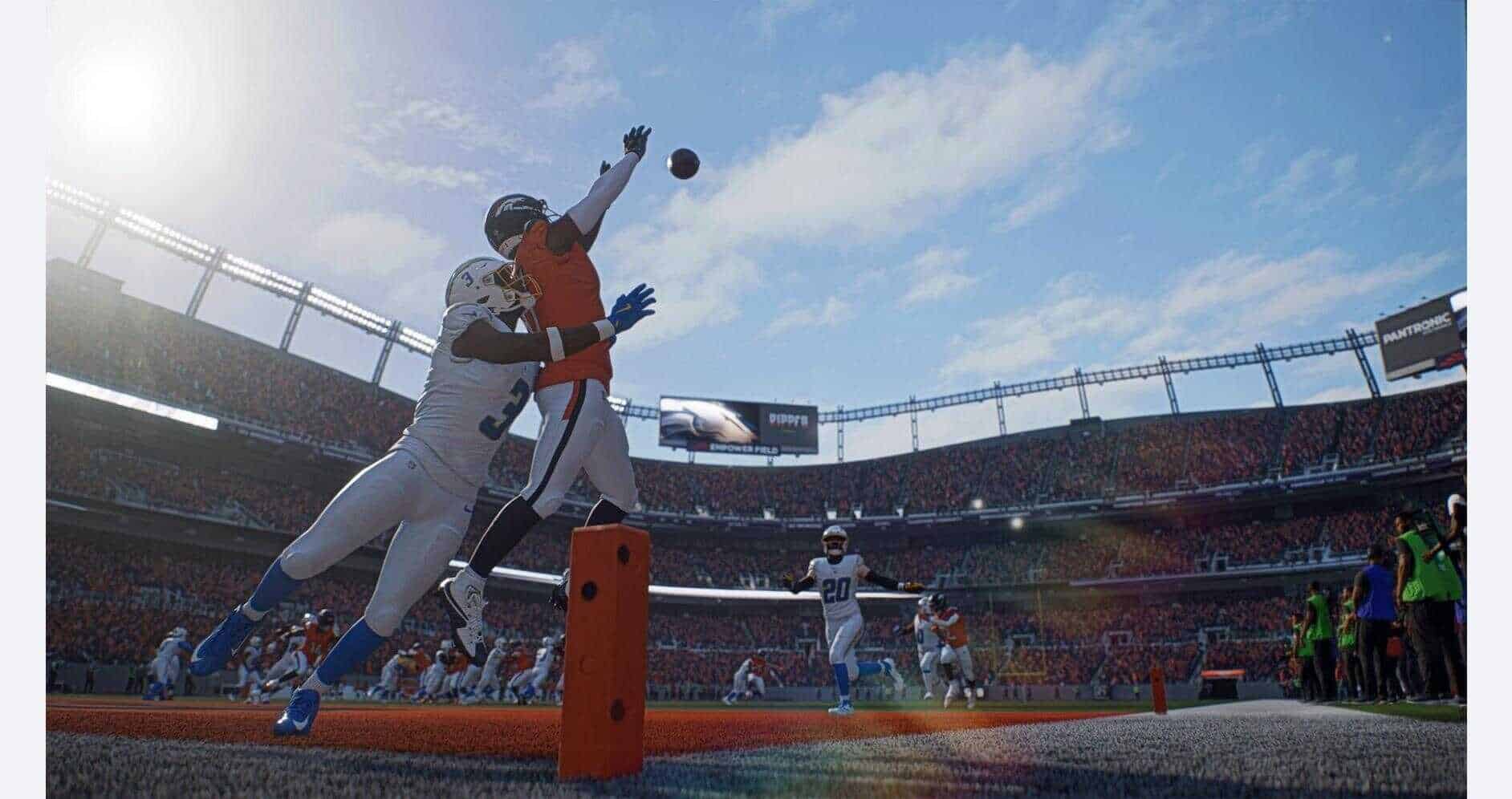 Football players competing for the ball in a stadium during Madden NFL 27.