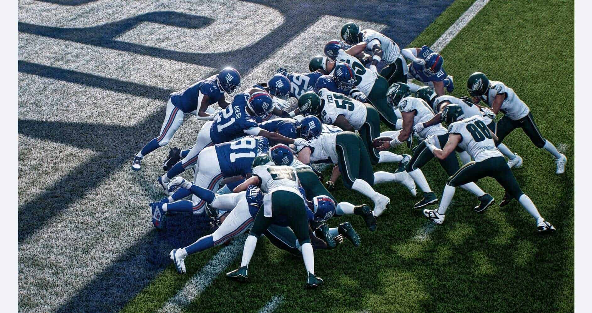 Football players in a game, pushing for yardage on the field.