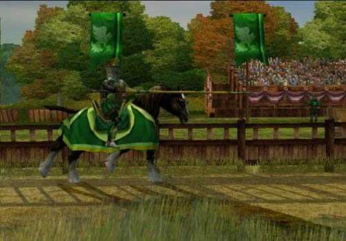 Knight in green armor riding a horse during a medieval tournament.