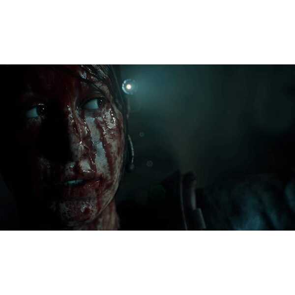 Close-up of a blood-smeared face in a dark, tense horror game setting.