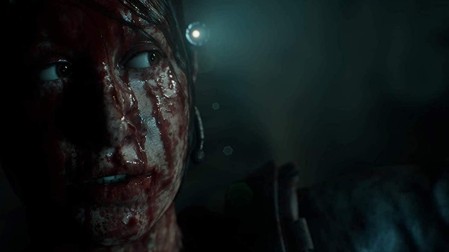 Close-up of a blood-smeared face in a dark, tense horror game setting.