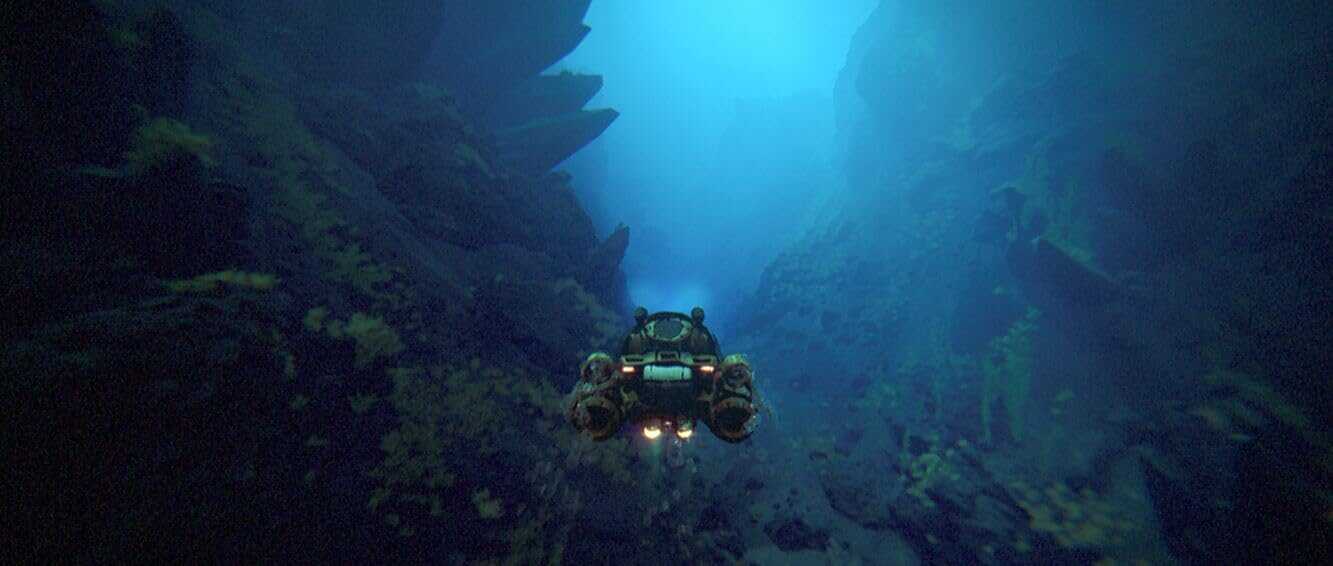Underwater exploration scene with a submarine in deep blue waters.