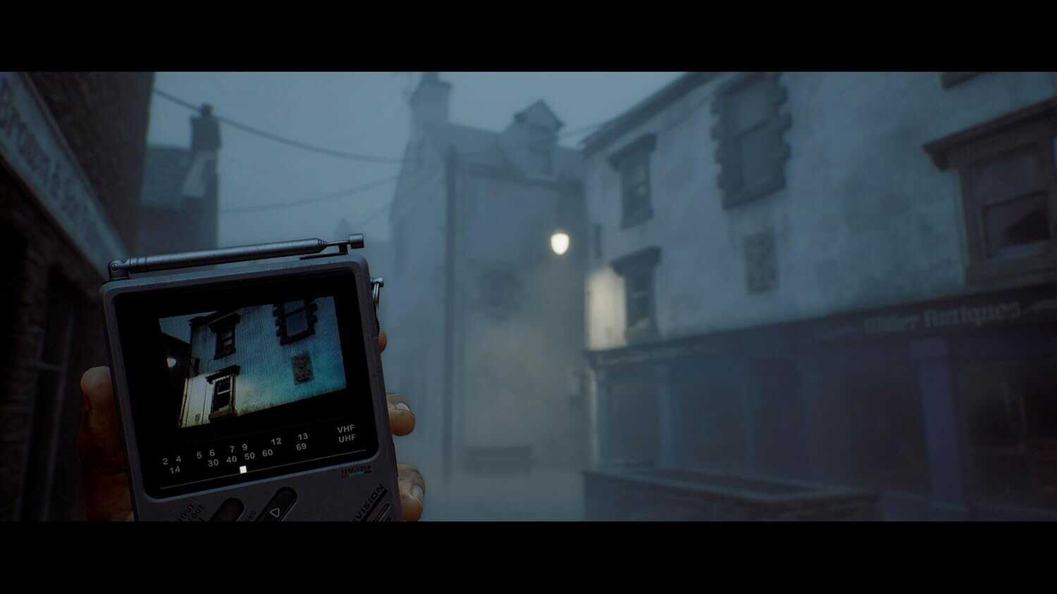 Foggy street scene from Silent Hill Townfall with handheld camera view.