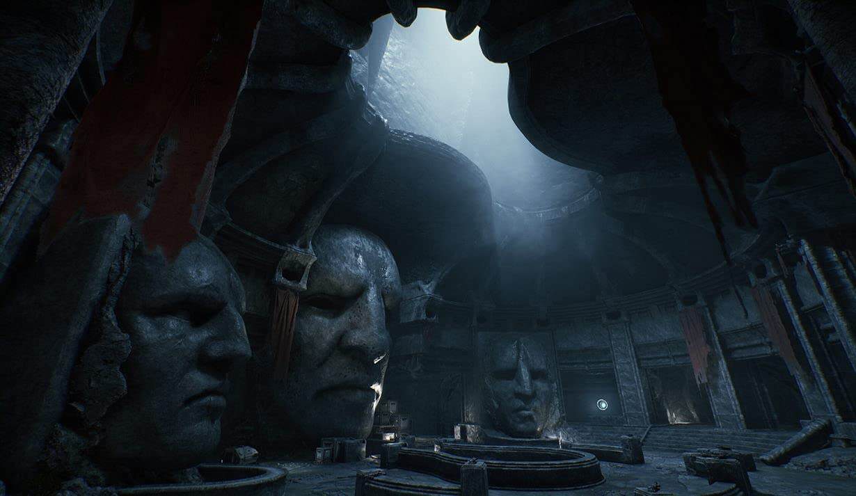 Dark, atmospheric scene with large stone heads and eerie lighting from a video game setting.
