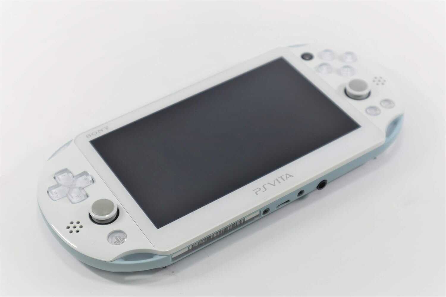 Light blue Sony PlayStation Vita Slim console with controls and screen.