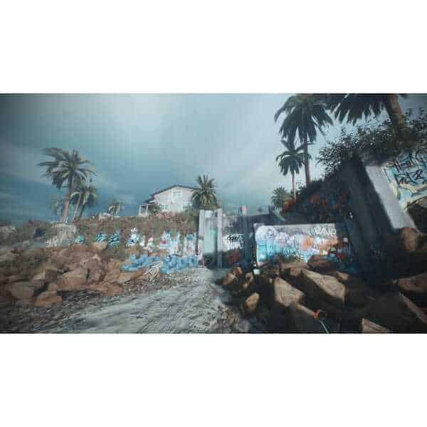 Urban scene with graffiti, rocks, and palm trees under cloudy sky.