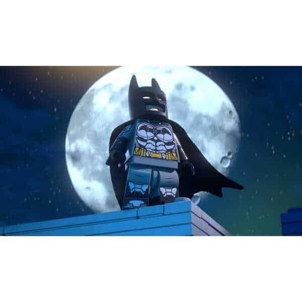 LEGO Batman figure with cape against a full moon background.