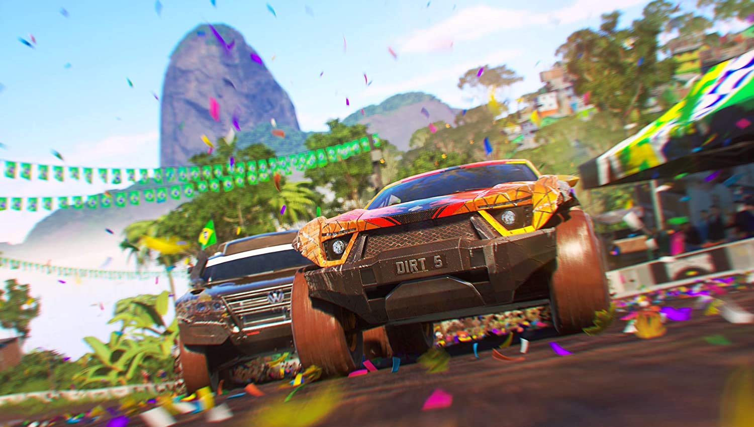 High-speed racing cars in vibrant tropical setting from Gameware's Dirt 5 game.