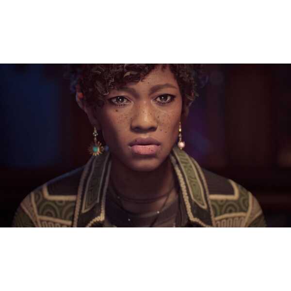 A young woman with natural curly hair and expressive eyes, wearing stylish clothing and jewelry, in.
