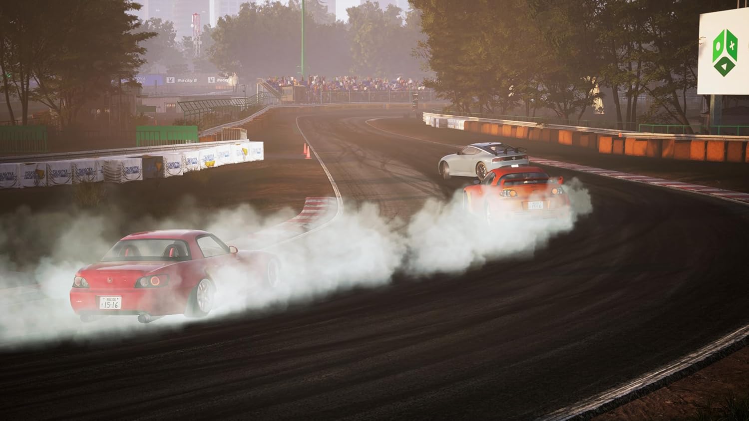 Drifting cars on a dirt track with smoke and dust at a racing event.