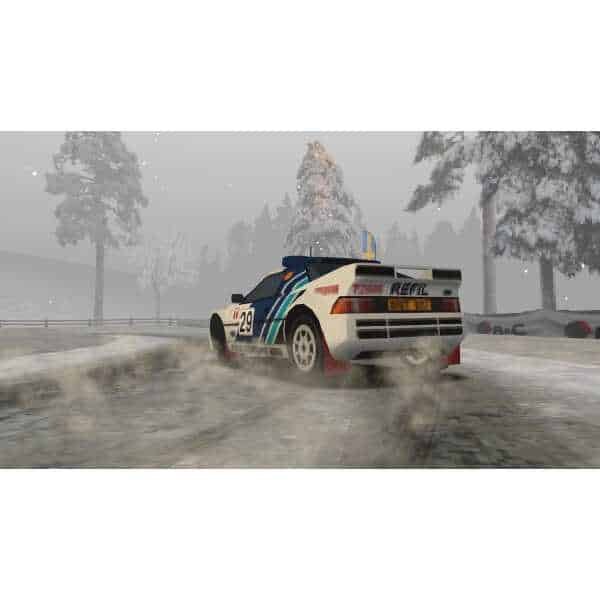 Rally car drifting on snowy track with trees in the background.