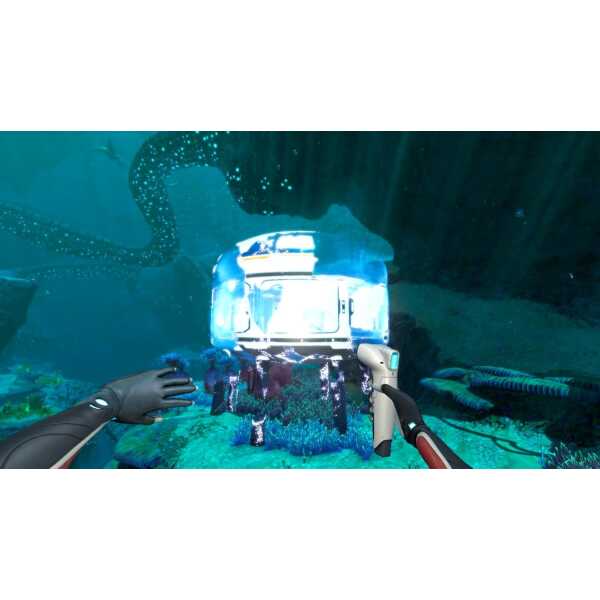 Underwater robot exploring coral reef with divers and marine life.