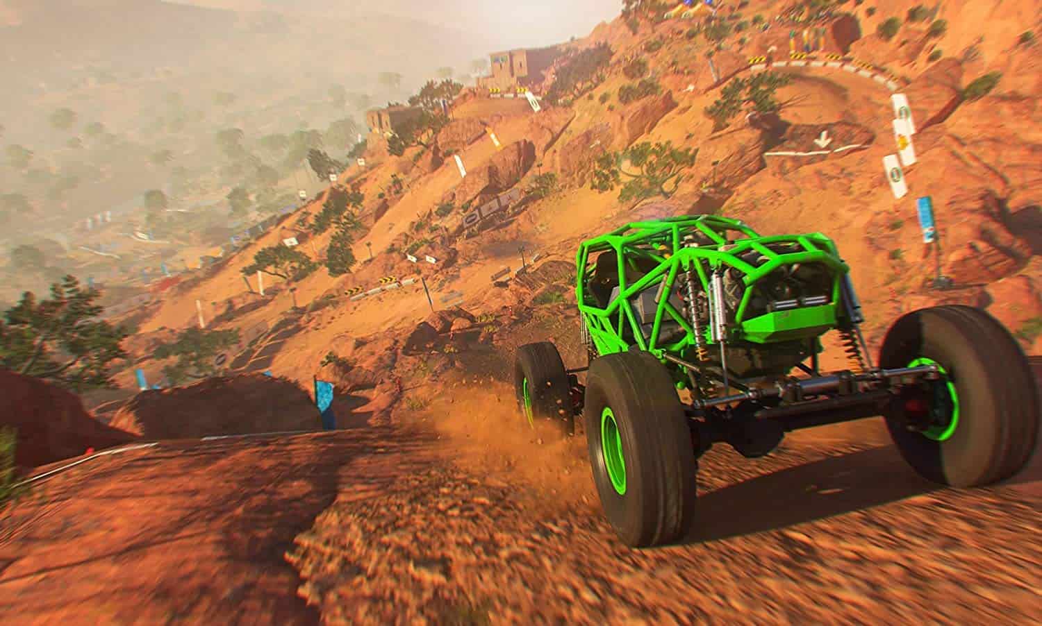 High-performance off-road racing vehicle navigating rugged terrain in a desert landscape.