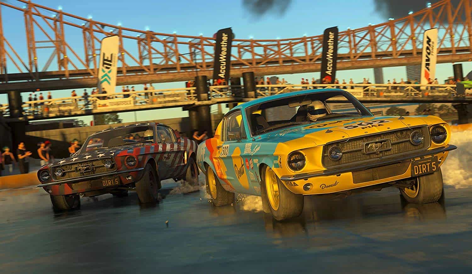 High-speed vintage race cars drifting on a wet track during a motorsport event.