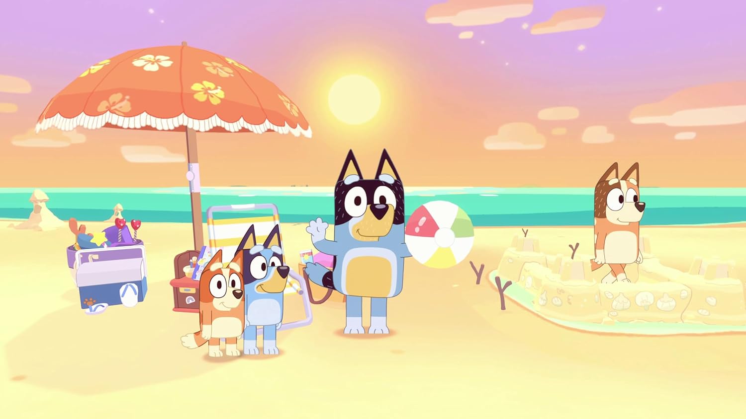 Cartoon cats enjoying a sunny beach with toys, umbrella, and beach ball at sunset.