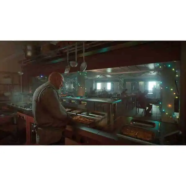 Chef preparing pizza in a cozy, festive restaurant with warm lighting and holiday decorations.