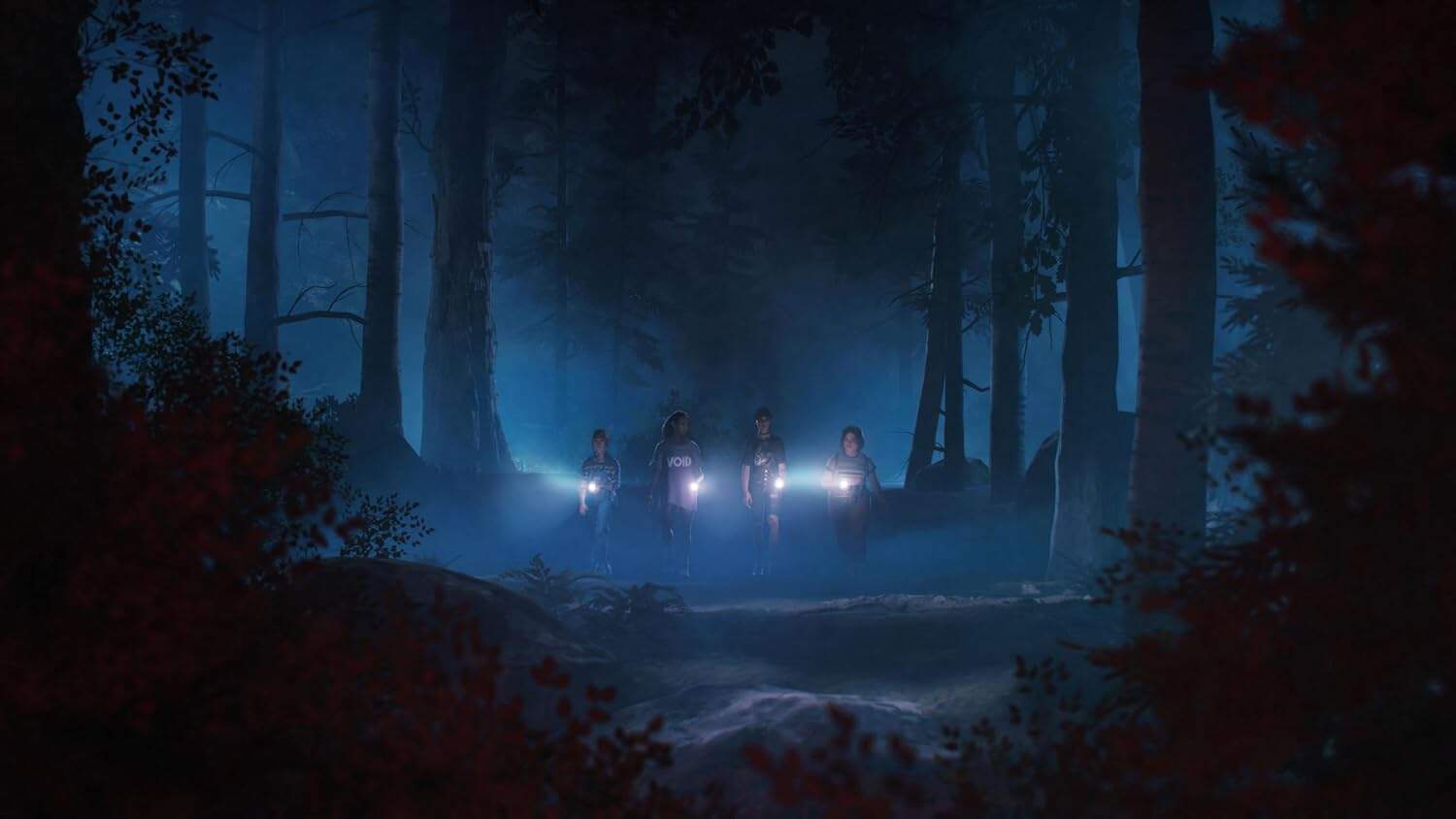 Group of explorers with flashlights in a dark, foggy forest at night.