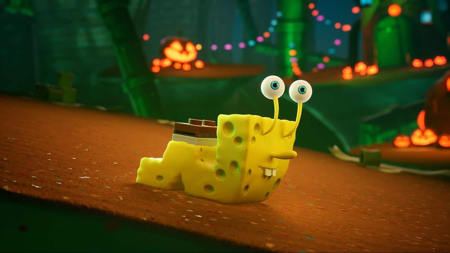 SpongeBob figurine with googly eyes on a Halloween-themed background.