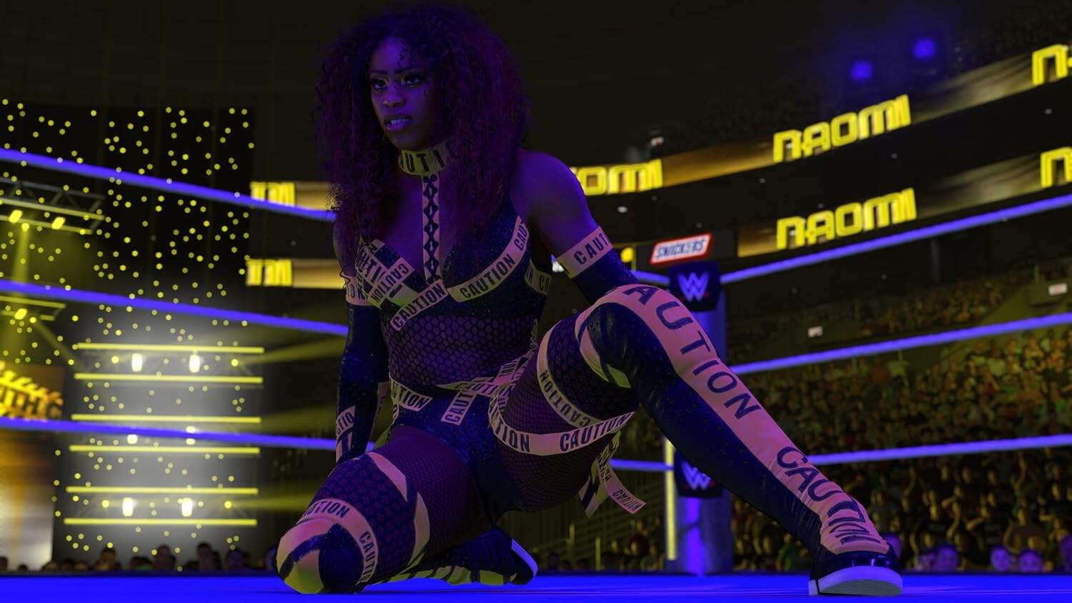 Female wrestler in WWE 2K26 game with caution tape costume at gaming event.
