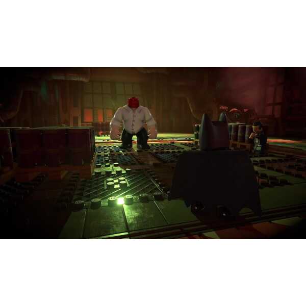 LEGO Batman facing Joker in a dark, industrial setting from LEGO Batman: Legacy of the Dark Knight.