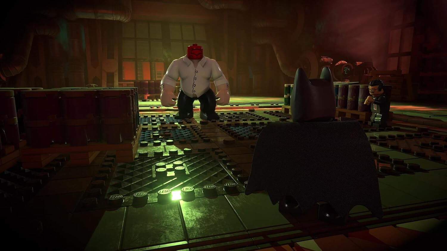 LEGO Batman facing Joker in a dark, industrial setting from LEGO Batman: Legacy of the Dark Knight.