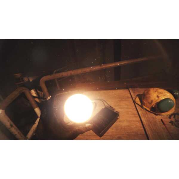 Close-up of a bright light source on a wooden table with gaming accessories.