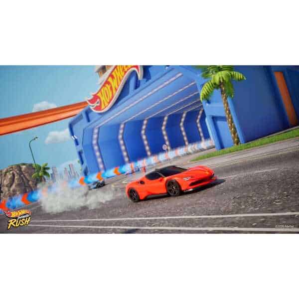 Hot Wheels car racing on track with Hot Wheels Hot Spot in background.