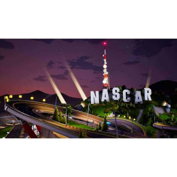 NASCAR night race illuminated with bright lights and racing track at dusk.