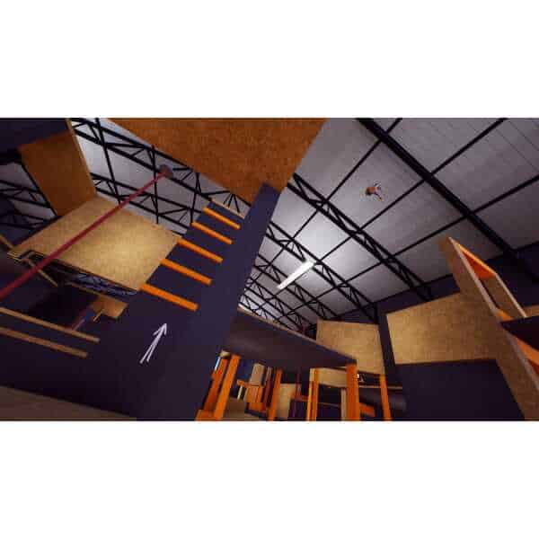 Indoor parkour training facility with climbing walls and obstacle courses.