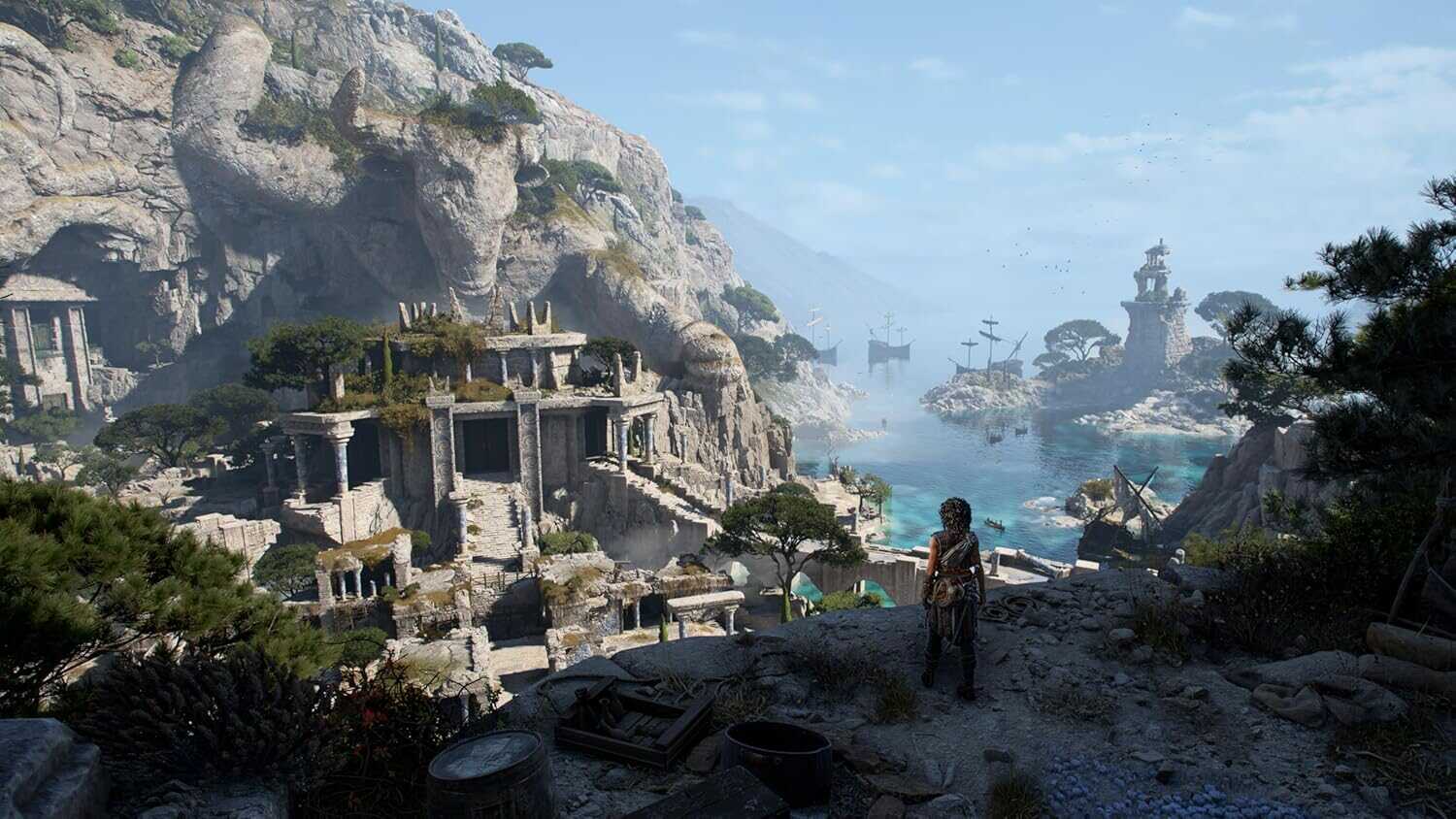 Ancient coastal ruins with mountains and ships in the background.