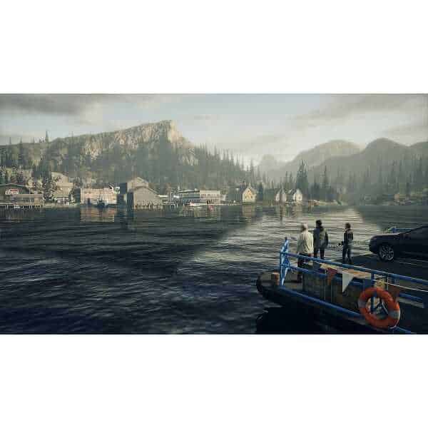 Scenic view of a lakeside town with mountains in the background, featuring four people on a boat doc.