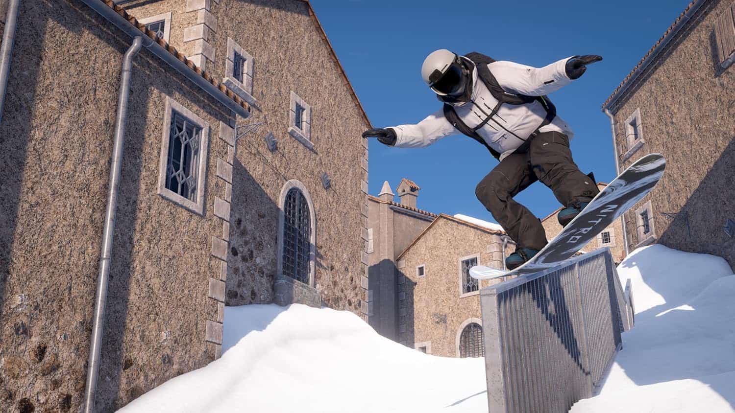 Action shot of a snowboarder performing a trick in snowy urban setting.