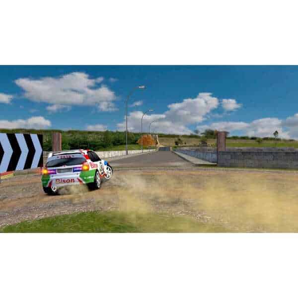 Rally car speeding on dirt road during an old school rally event.