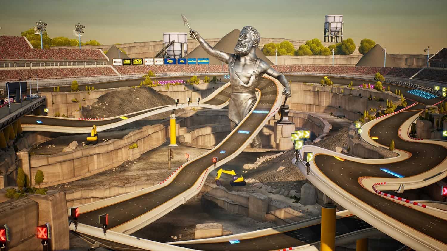 Indoor go-kart racing track with a large statue and winding tracks for competitive fun.